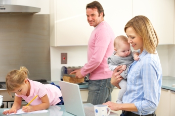Family busy together in kitchen